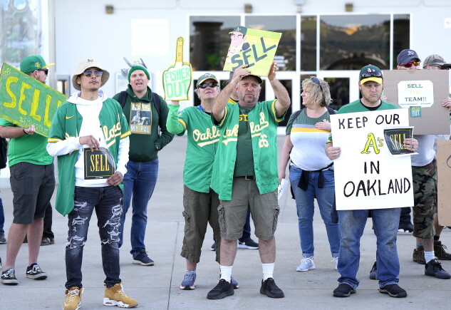 Oakland Athletics fans protest the club’s planned move to Las Vegas outside RingCentral Coliseum on April 28, 2023.