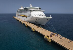 Tourists disembark from the Royal Caribbean Adventure of the Seas cruise ship in Cabo Rojo, Pedernales Province, Dominican Republic, Aug. 13, 2025.