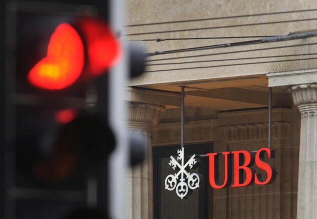A traffic light is seen in front of an office of the Swiss banking giant UBS in Lausanne.